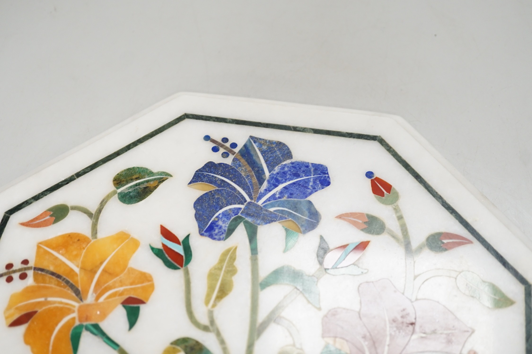 An Agra hardstone inlaid table top. 30cm wide